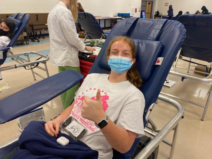 Morgan Santo (Senior) donating blood. (Kiana Wilson)