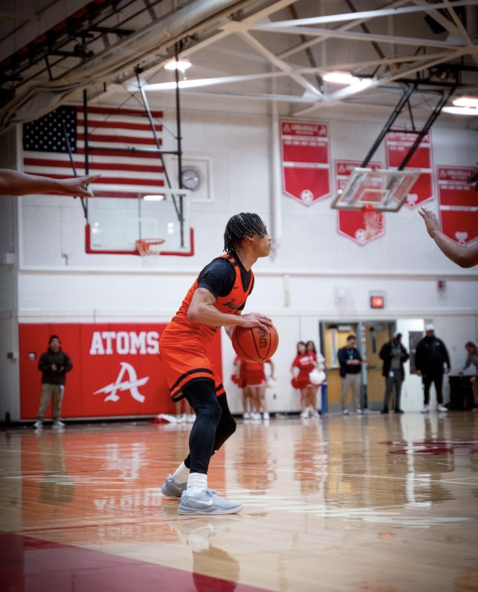 Julian Merritt (Sr) Looking to move the ball down court.