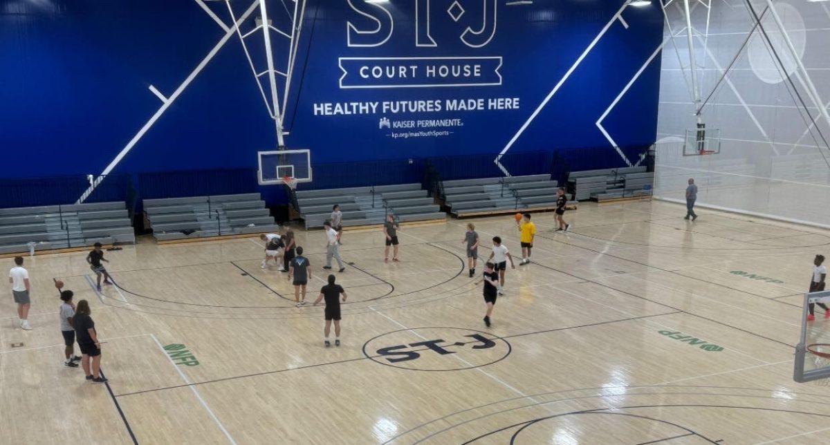 Students playing basketball during ANGP event in June 2024