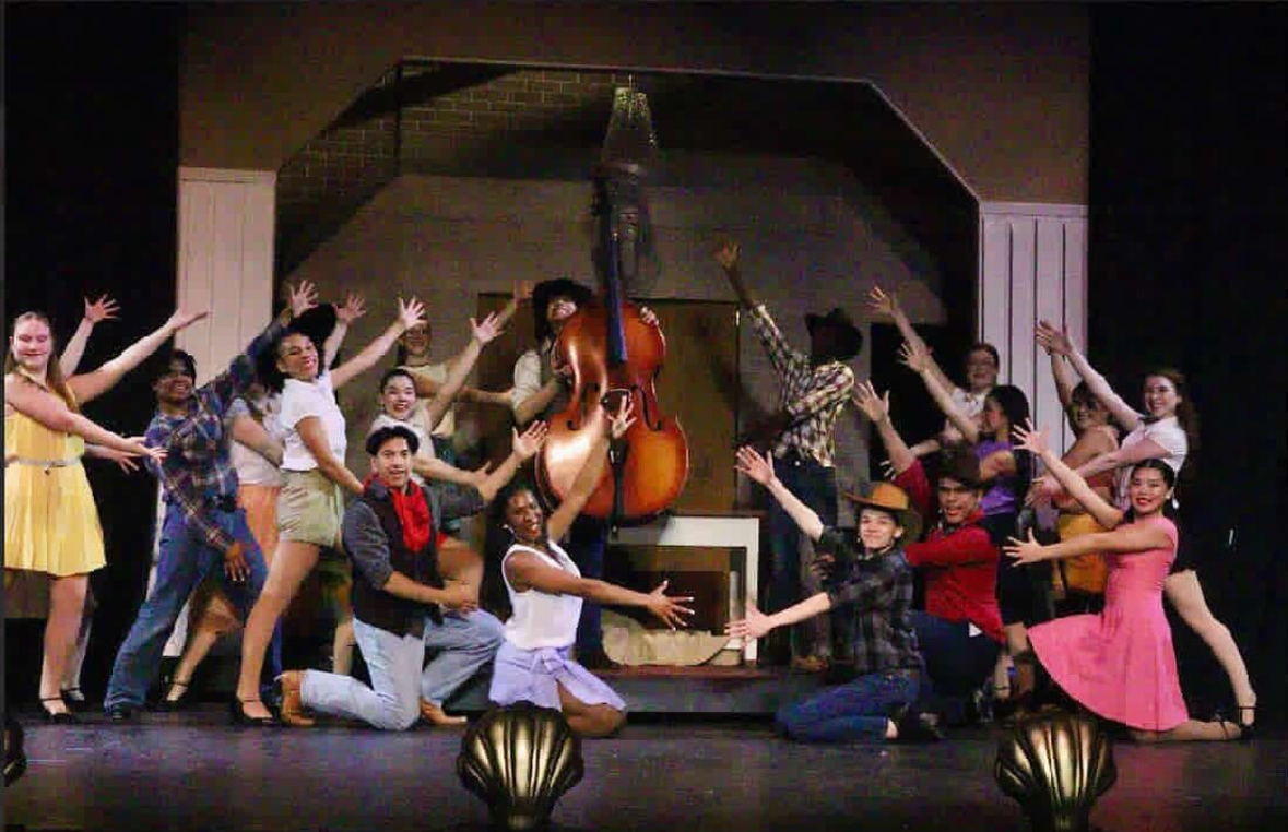 "Crazy For You" cast performing onstage in Hayfield Secondary. 