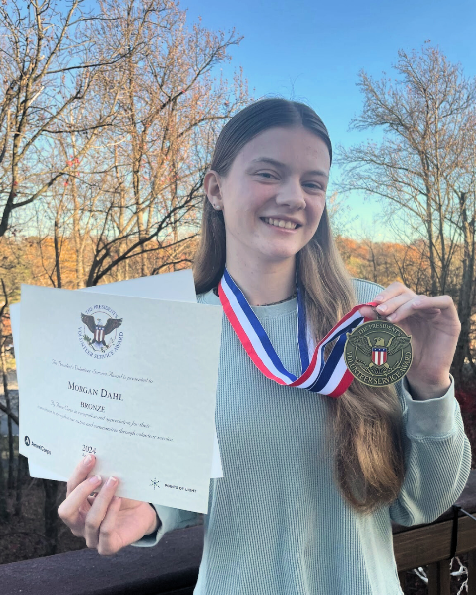 Senior Morgan Dahl posing with her President’s Volunteer Service Award in 2024. Photo Courtesy of Morgan Dahl